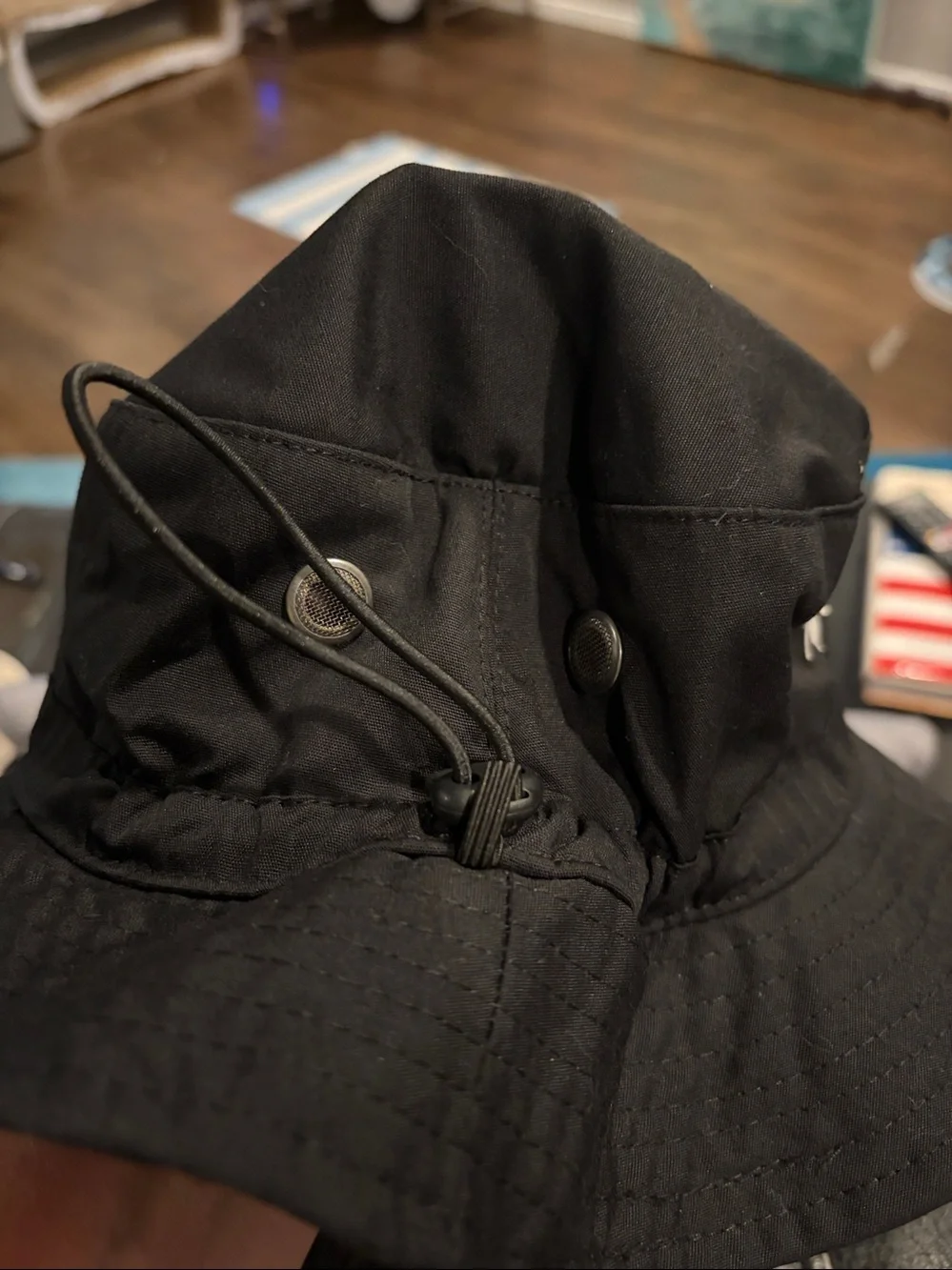Black Bucket Hat with White Bee Logo